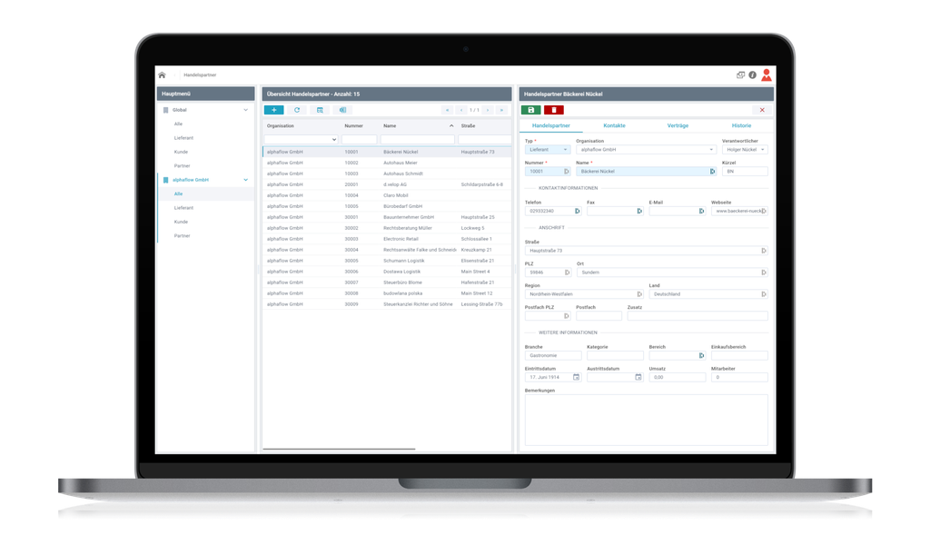 Laptop displaying a business management software interface with a list of partners, contact details, and organizational information.