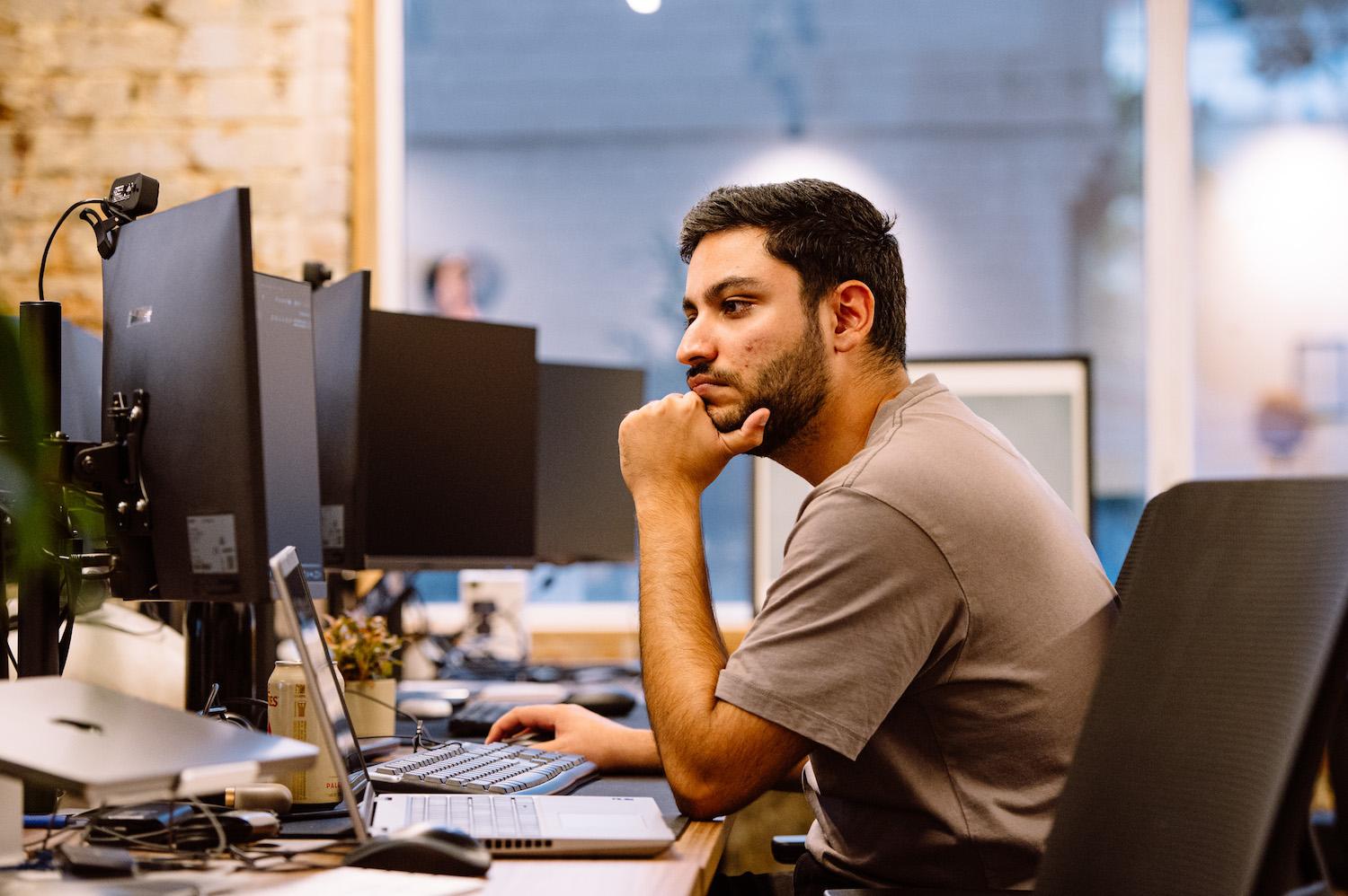Pulkit, Software Engineering Team Lead at Karbon, concentrating on this computer.