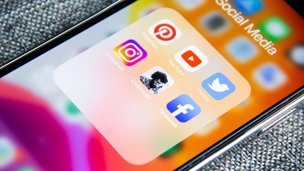 iPhone with social media icons.