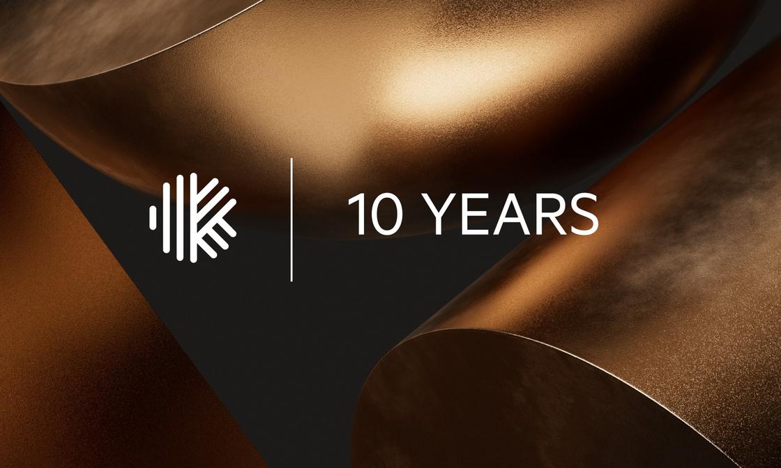 Karbon's 10th anniversary celebration graphic with metallic gold shapes and the company logo.