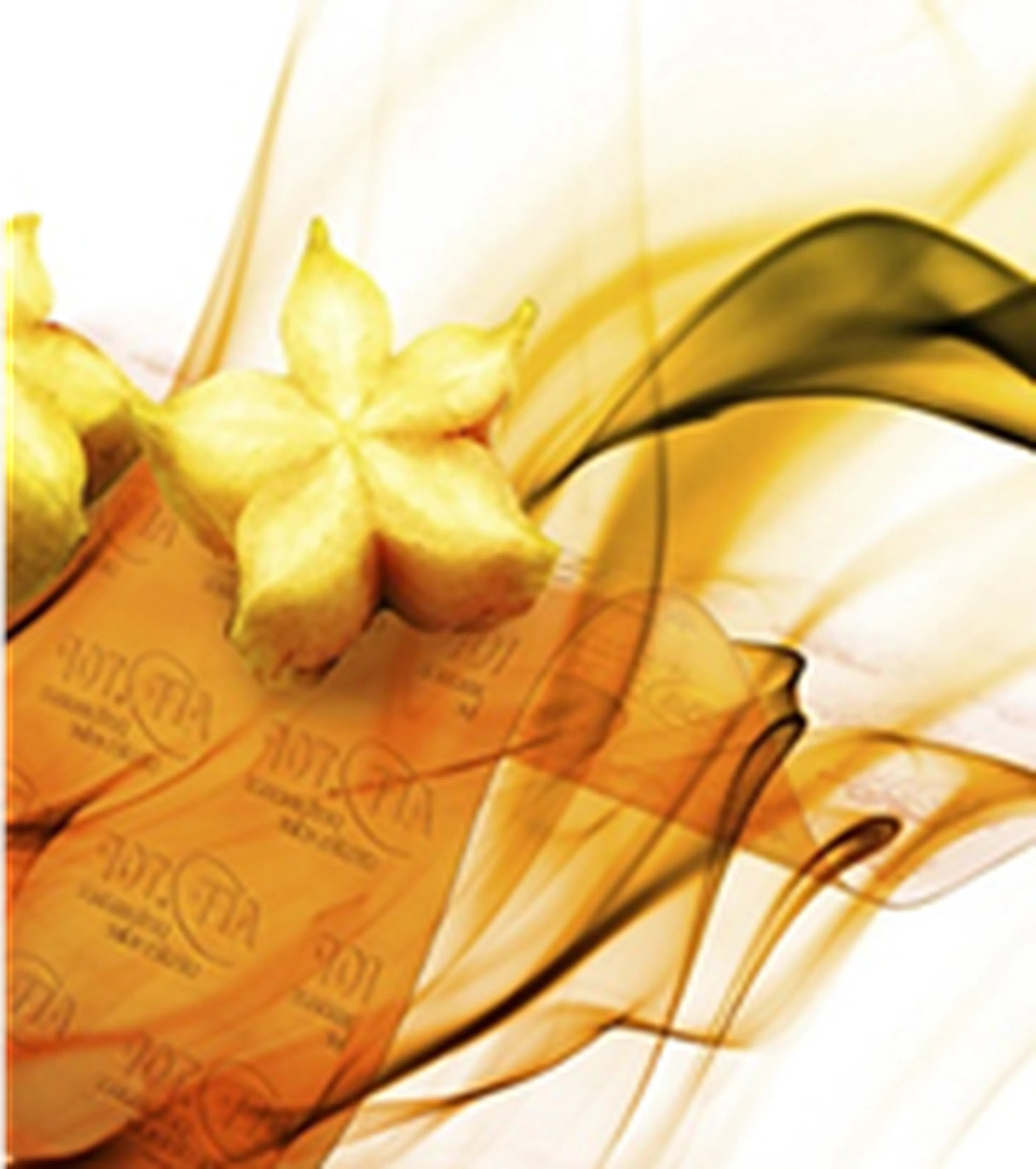 A sliced starfruit with dynamic, swirling orange and green abstract waves in the background.