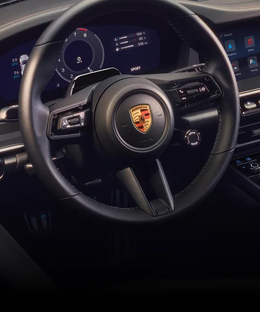 Detailed view of the GT sports steering wheel in the cockpit of the Porsche 911 Carrera T Cabriolet.