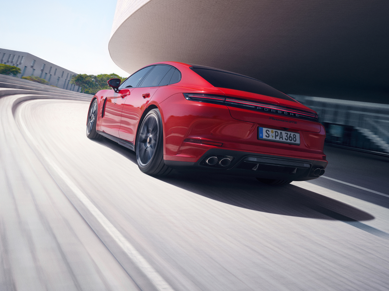 Porsche Panamera GTS in motion showing its active rear spoiler deployed