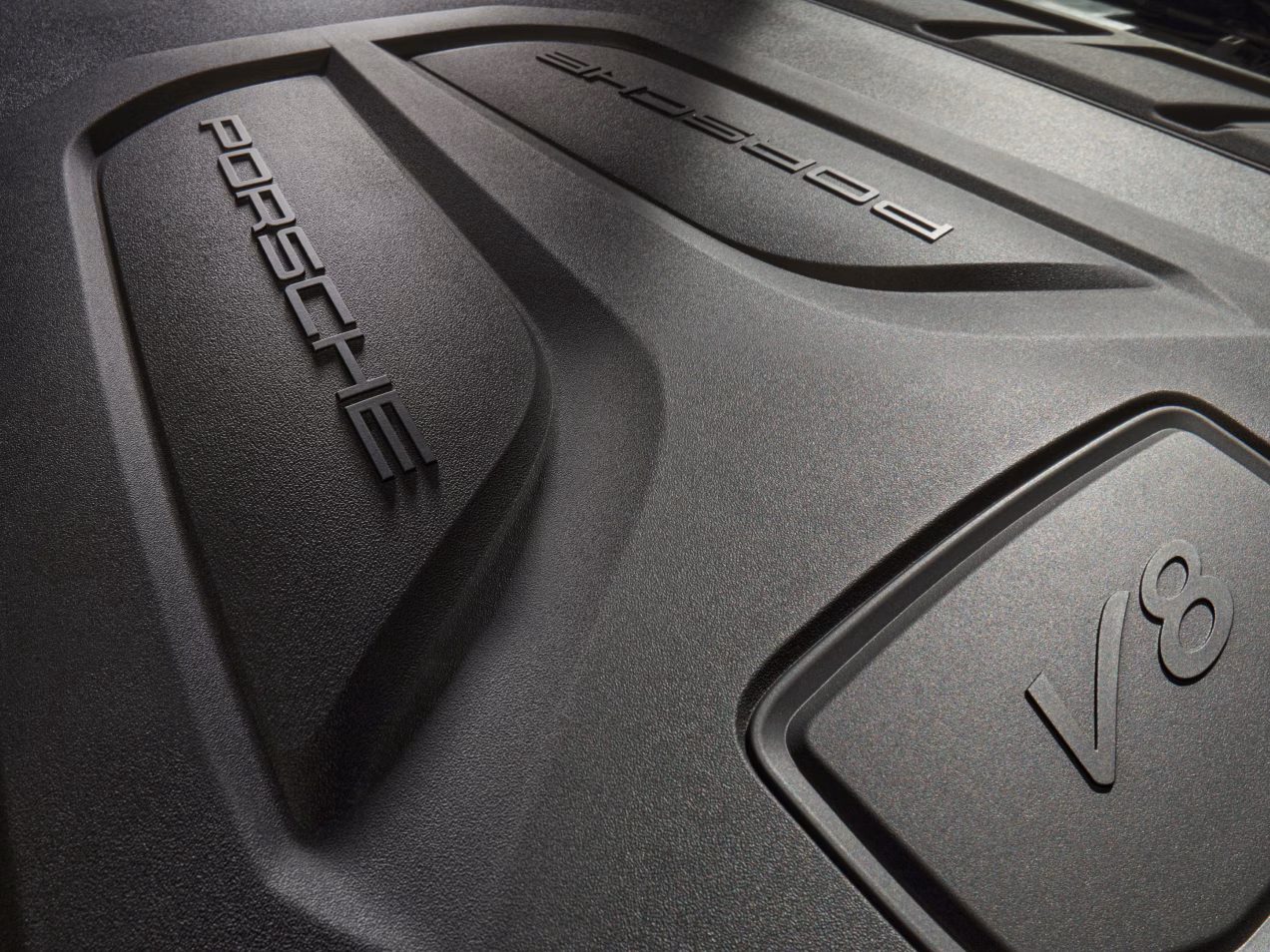 Porsche Cayenne GTS:  View under the bonnet of the engine cover with V8 badge.