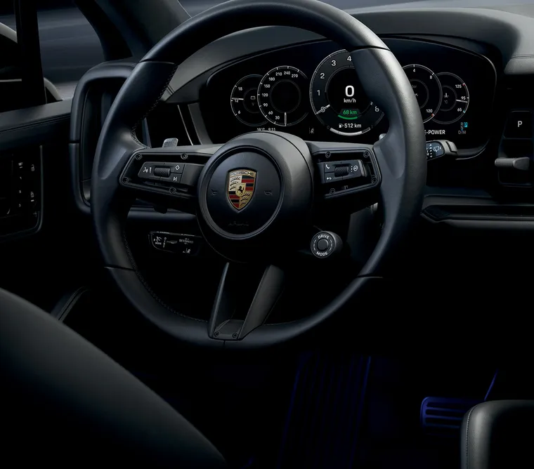 Detailed view of the GT sports steering wheel on the Porsche Cayenne Black Edition.