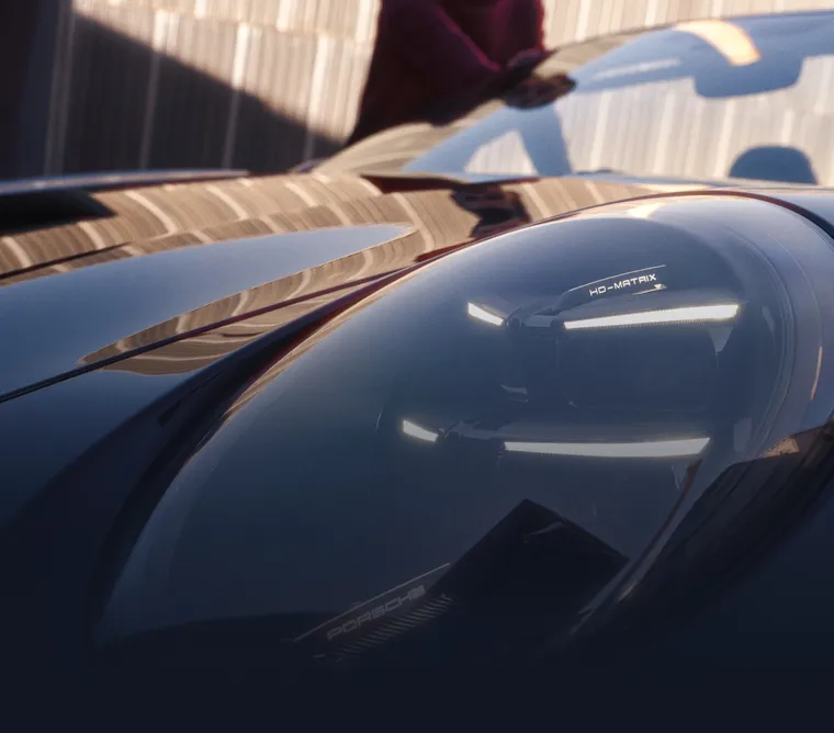 Detailed view of a Matrix LED main headlight on the Porsche 911 Carrera GTS Cabriolet in Black.