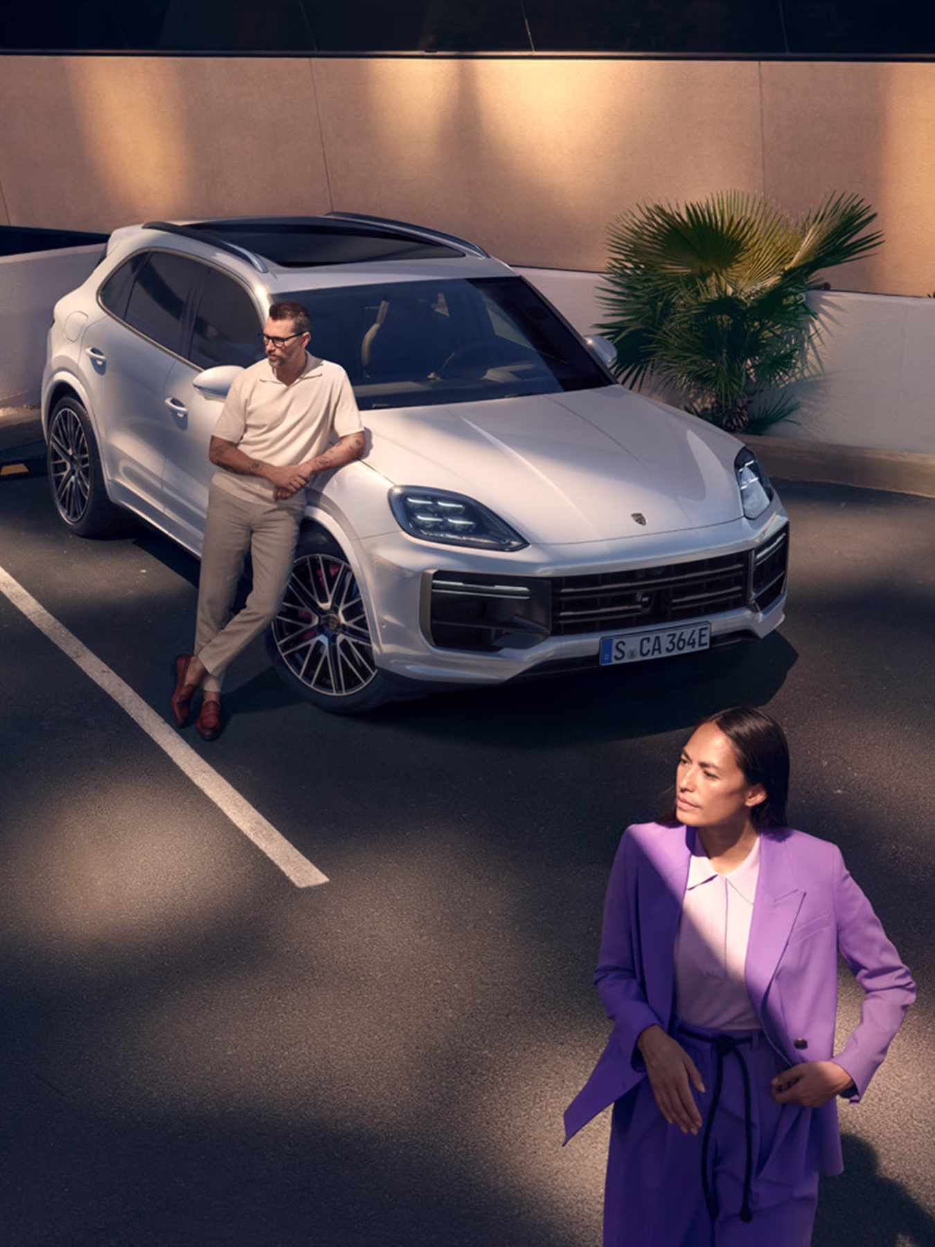 A Taycan being charged using a Porsche Destination Charging unit.