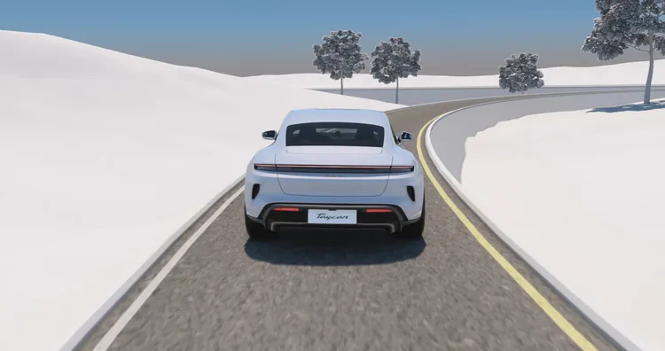 View of the rear of a moving Porsche Taycan.