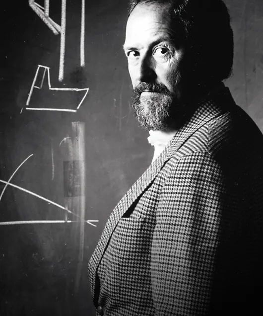 Historical photo of F. A. Porsche wearing a chequered jacket.