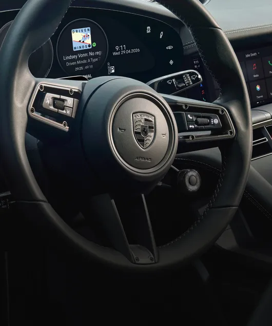 Porsche Taycan Turbo Cross Turismo interior. Detailed view of the steering wheel.