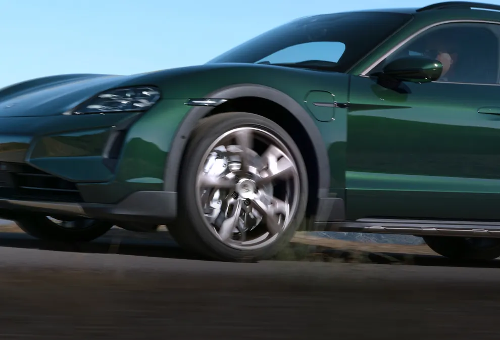 Porsche Taycan Turbo Cross Turismo in Oak Green Metallic Neo. Front and side view.
