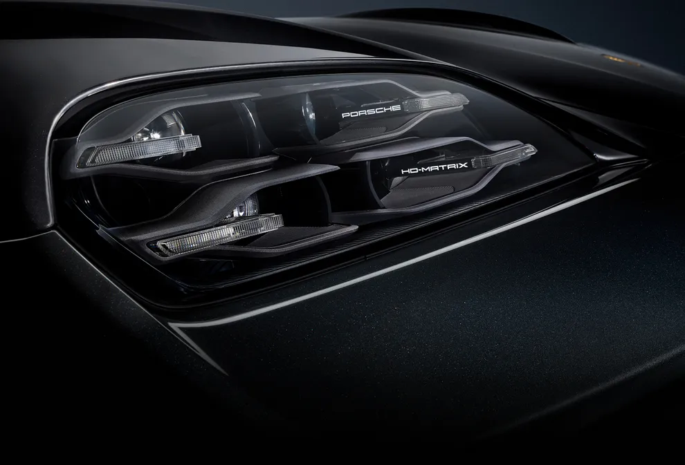 Detailed view of the HD-Matrix LED main headlights on the Porsche Taycan 4S Black Edition in Jet Black Metallic.