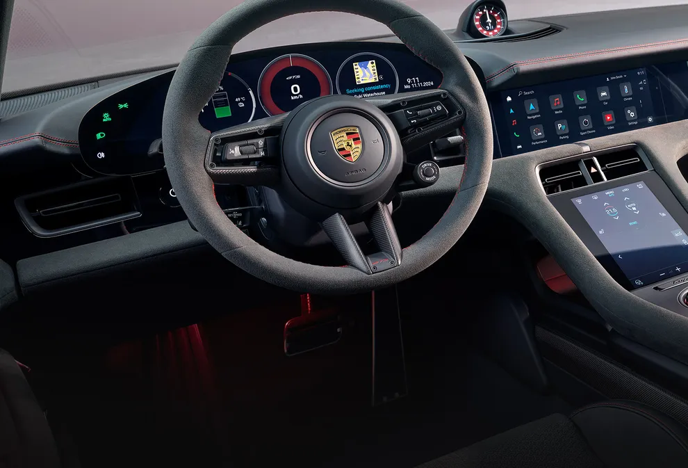 View into the cockpit of the Porsche Taycan GTS focusing on the steering wheel.