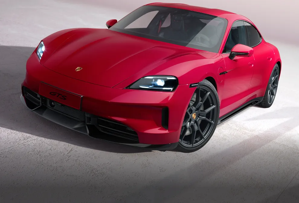 View of the front of the Porsche Taycan GTS in Carmine Red.