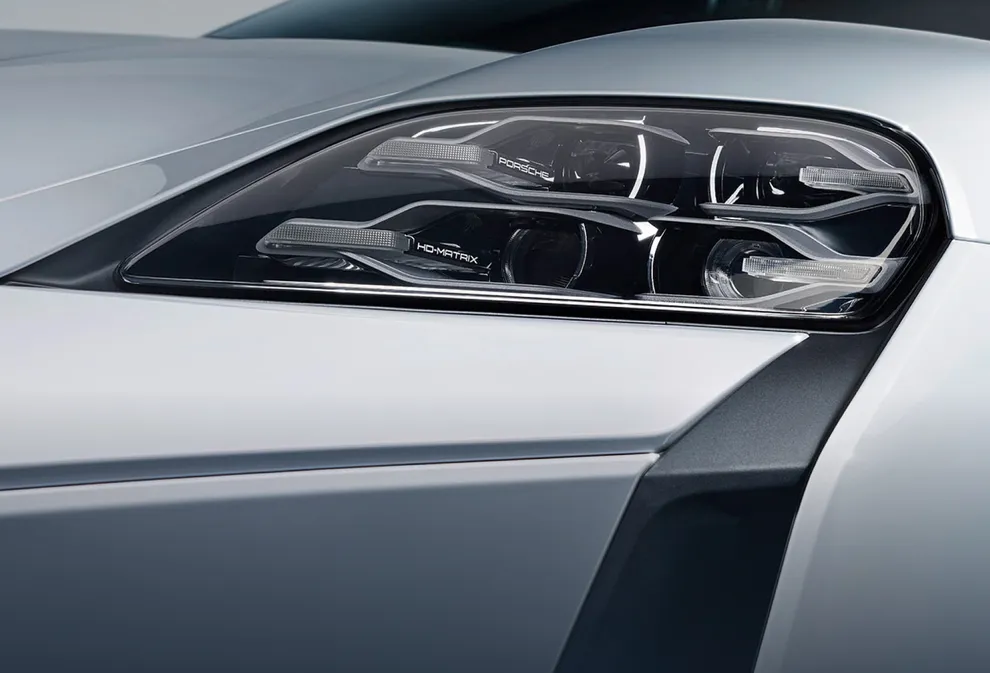 Porsche Taycan Turbo S in Ice Grey Metallic. Detailed view of the HD matrix LED main headlight.