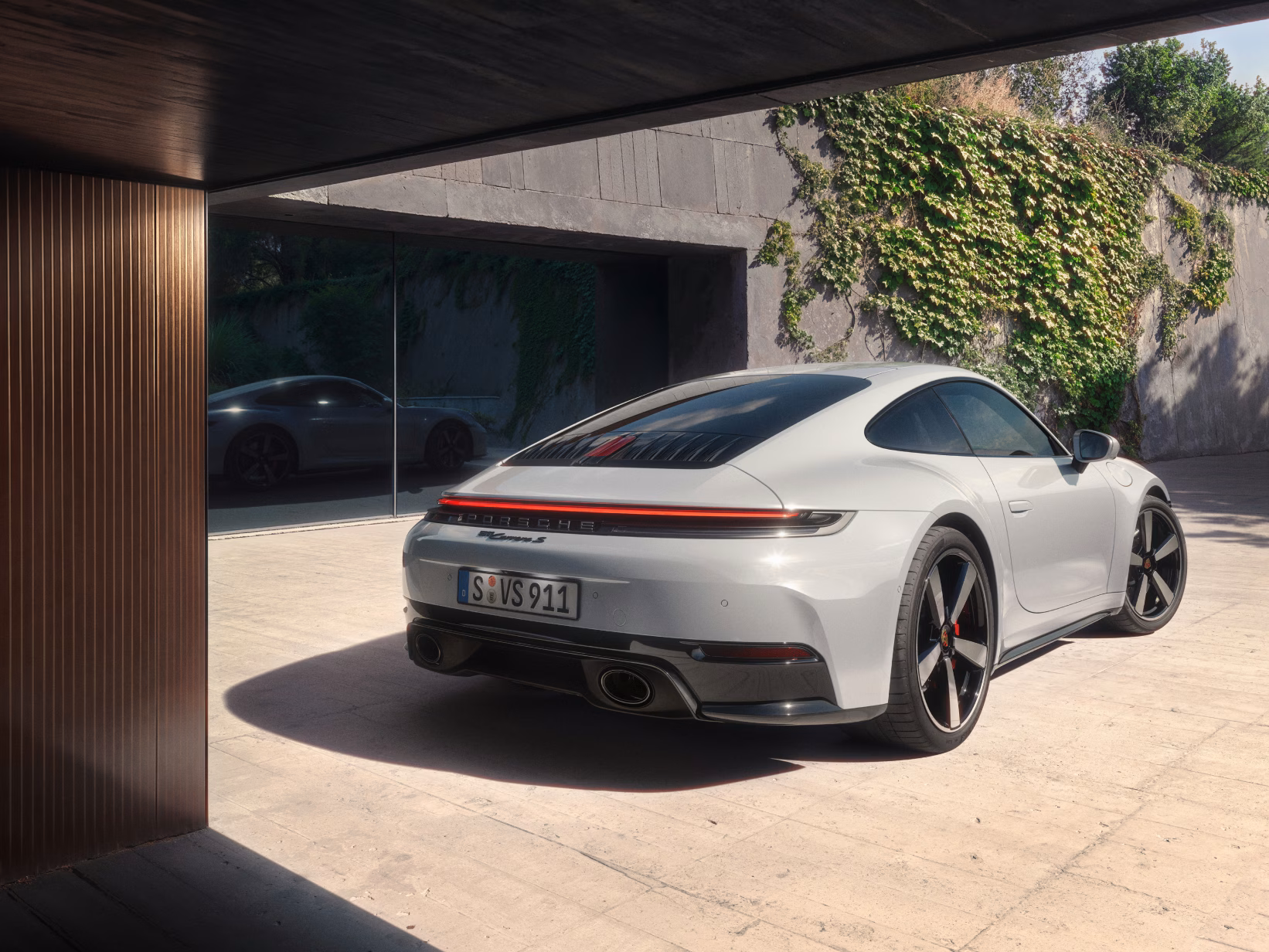 Rear view of the Porsche 911 Carrera S in Ice Grey Metallic.