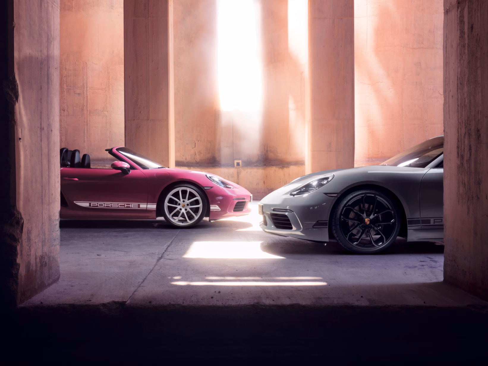 Porsche 718 Cayman Style Edition and Porsche 718 Boxster Style Edition parked opposite each other.