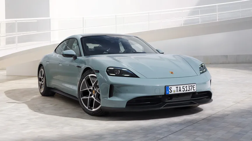 A sky blue Porsche Taycan in a minimalist urban setting with natural lighting 