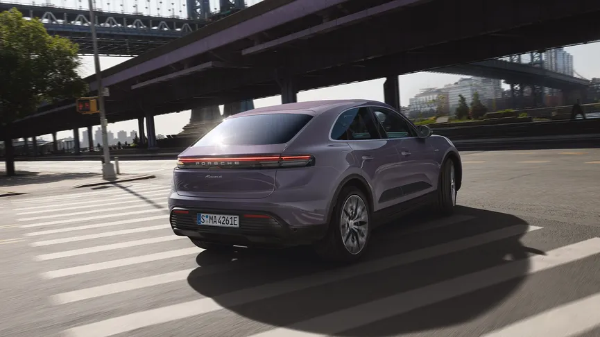 The Macan Electric in Provence driving along a main road.