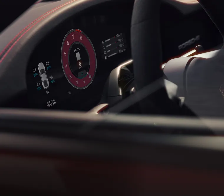 Vista del volante y del cuadro de instrumentos o pantalla curva en el Porsche 911.
