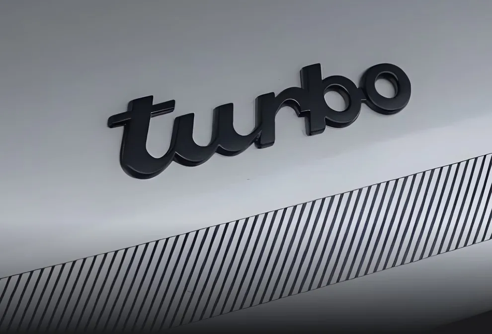 Detailed view of the "Turbo" lettering  on the rear of a Porsche 911 Turbo.
