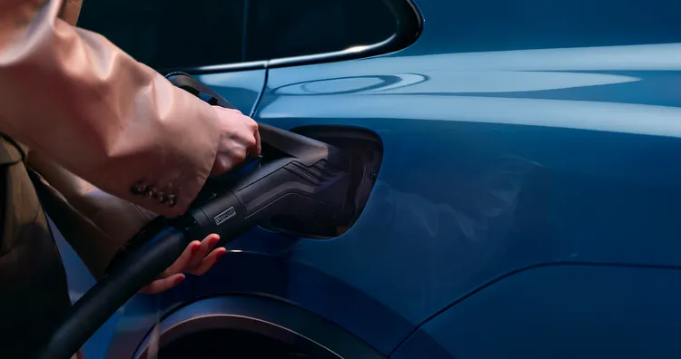 A Porsche Macan being charged.