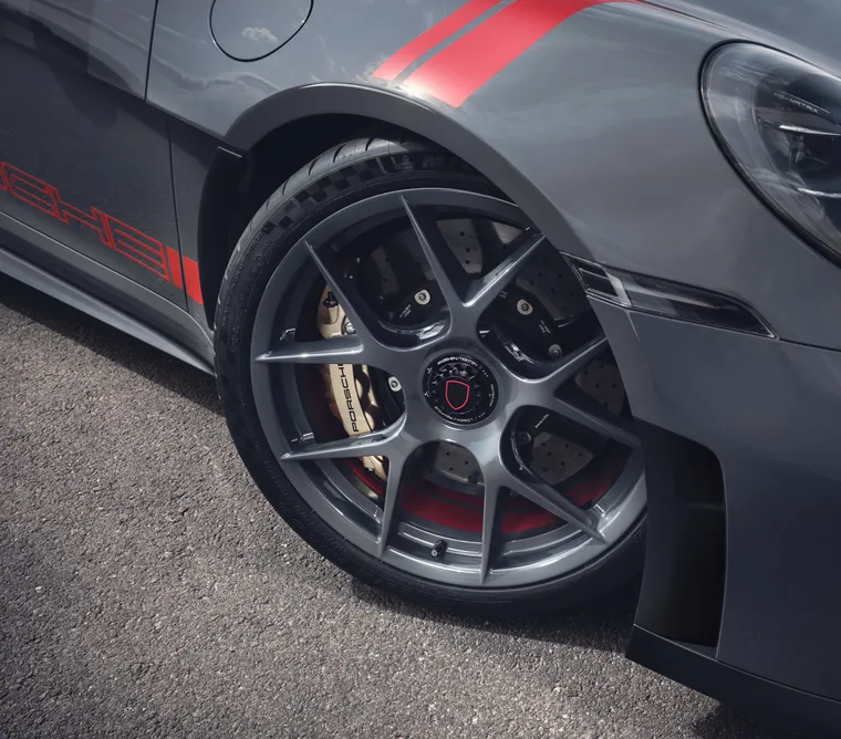 Detailed view of the GT3 lightweight forged magnesium wheel in Slate Grey Neo on the Porsche 911 GT3 S/C with Street Style package.