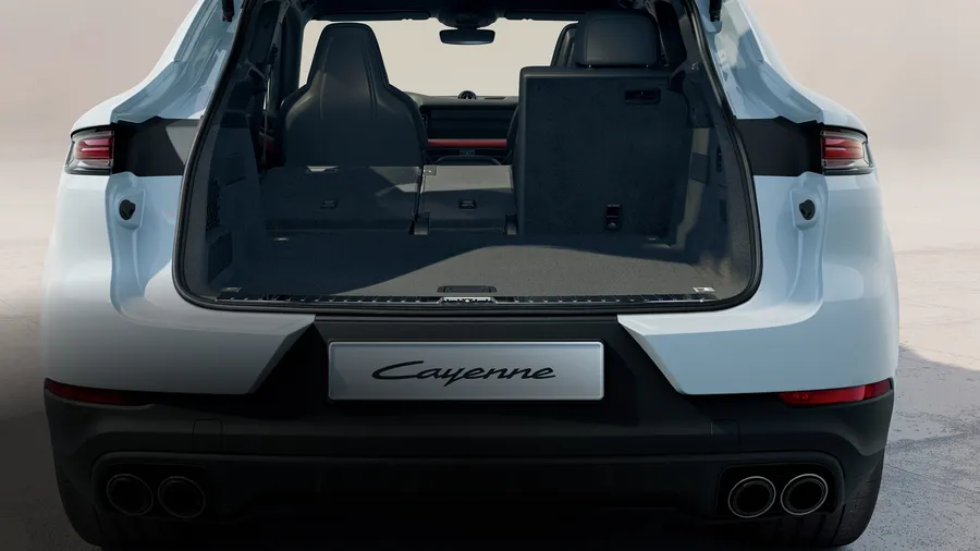 Porsche Cayenne E-Hybrid Coupé in Carrara White Metallic. Rear end view with luggage compartment open.