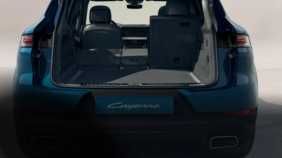 Porsche Cayenne in Montego Blue Metallic. Rear end view with luggage compartment open.