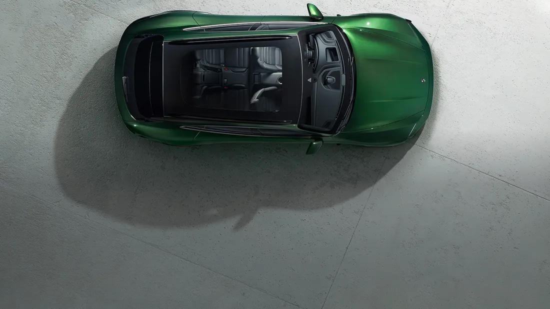 View from above / bird's eye view of Porsche Taycan Turbo Cross Turismo in Oak Green Metallic Neo.