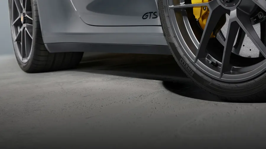 Porsche 911 Carrera GTS in Slate Grey Neo. Side view.