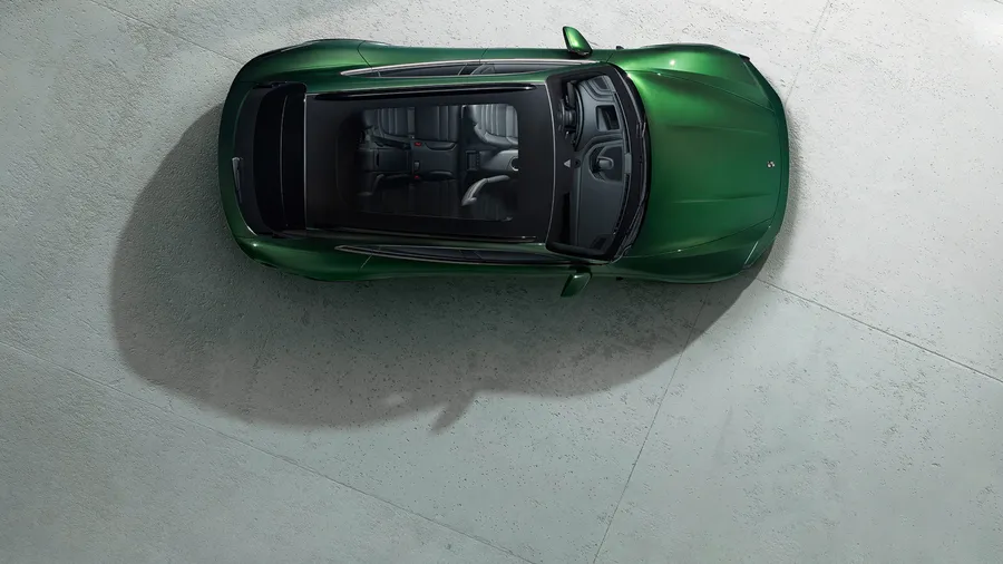 View from above / bird's eye view of Porsche Taycan Turbo Cross Turismo in Oak Green Metallic Neo.