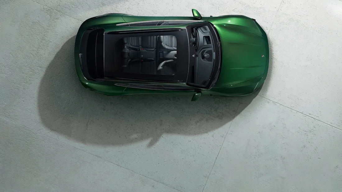 View from above / bird's eye view of Porsche Taycan Turbo Cross Turismo in Oak Green Metallic Neo.