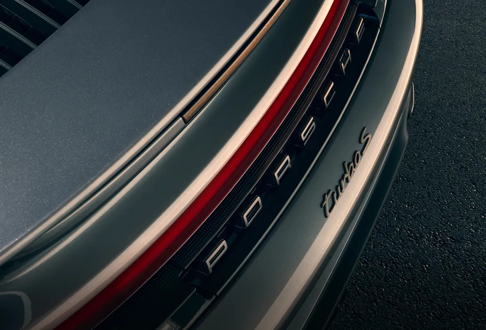 Detailed view of the rear logo in Turbonite on the Porsche 911 Turbo S.