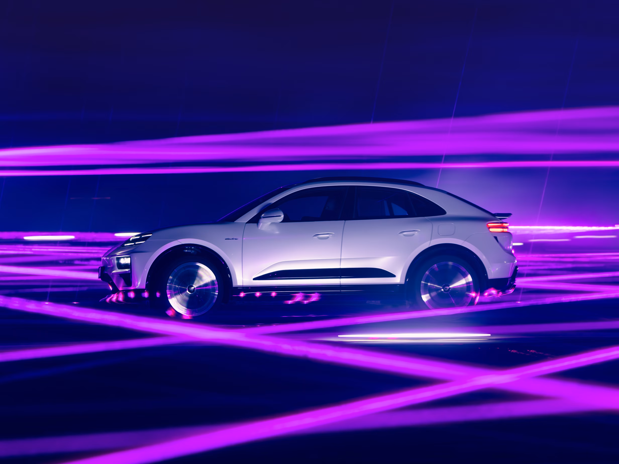 Porsche Macan Turbo in Ice Grey Metallic in profile/side view.