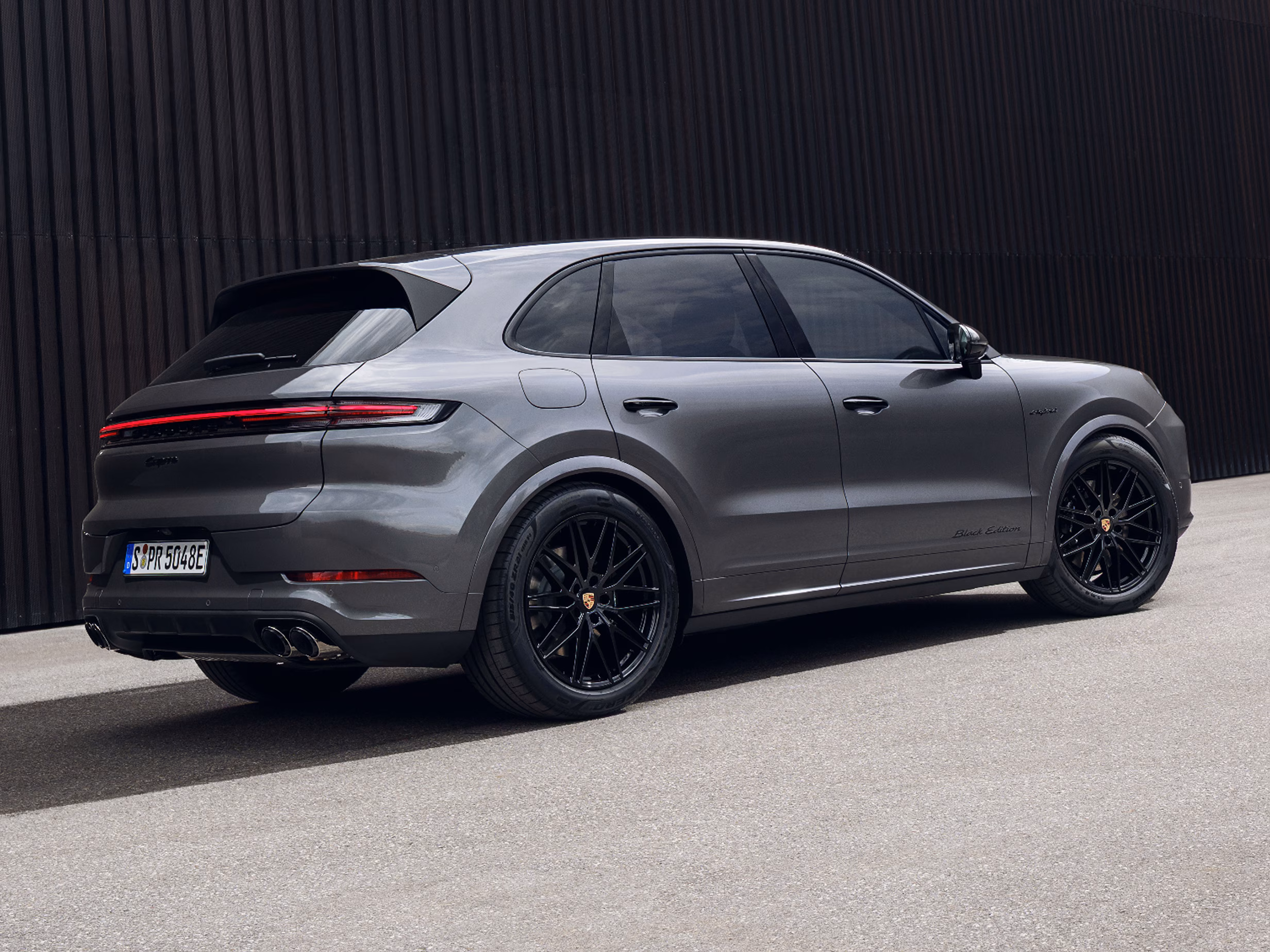 Rear view of the Porsche Cayenne Black Edition in Chromite Black Metallic.