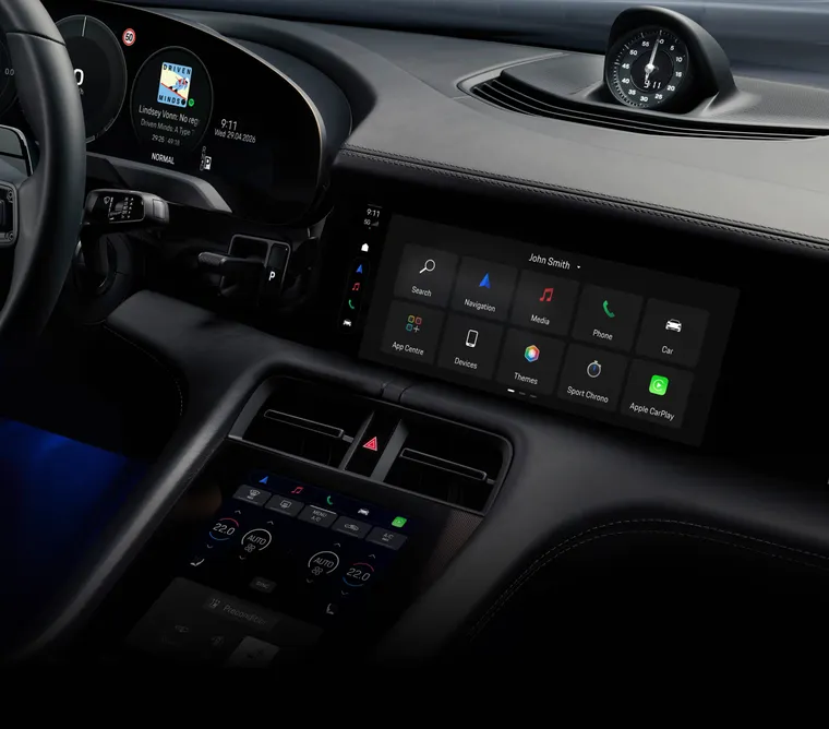 View into the cabin of the Porsche Taycan 4S Black Edition. The infotainment system screen shows the assistance systems.