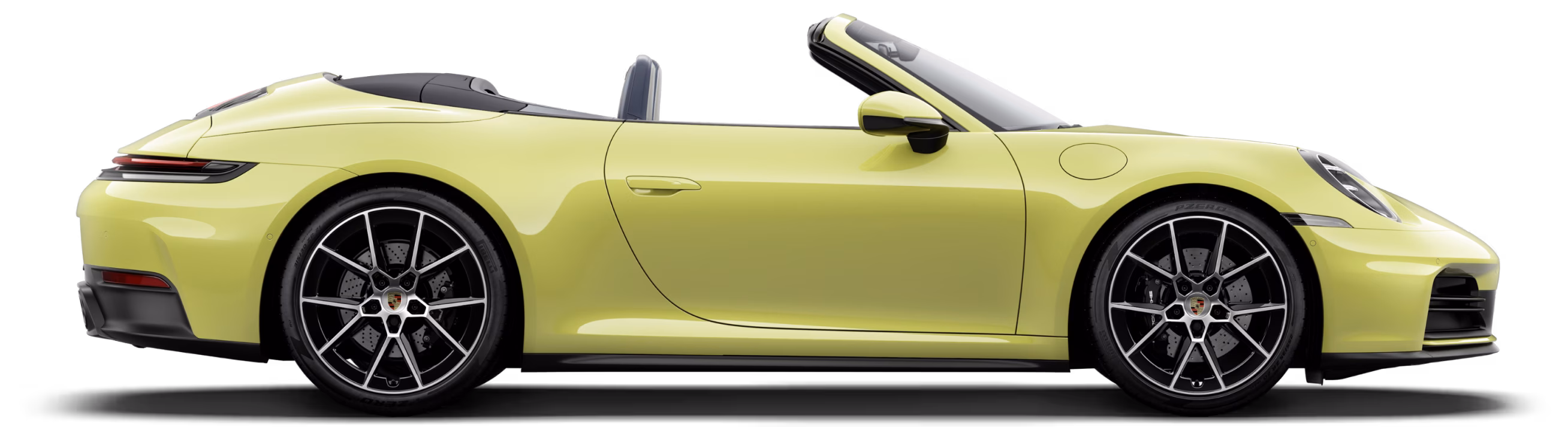 Porsche 911 Carrera Cabriolet in Cartagena Yellow Metallic with Black roof in profile/side view.