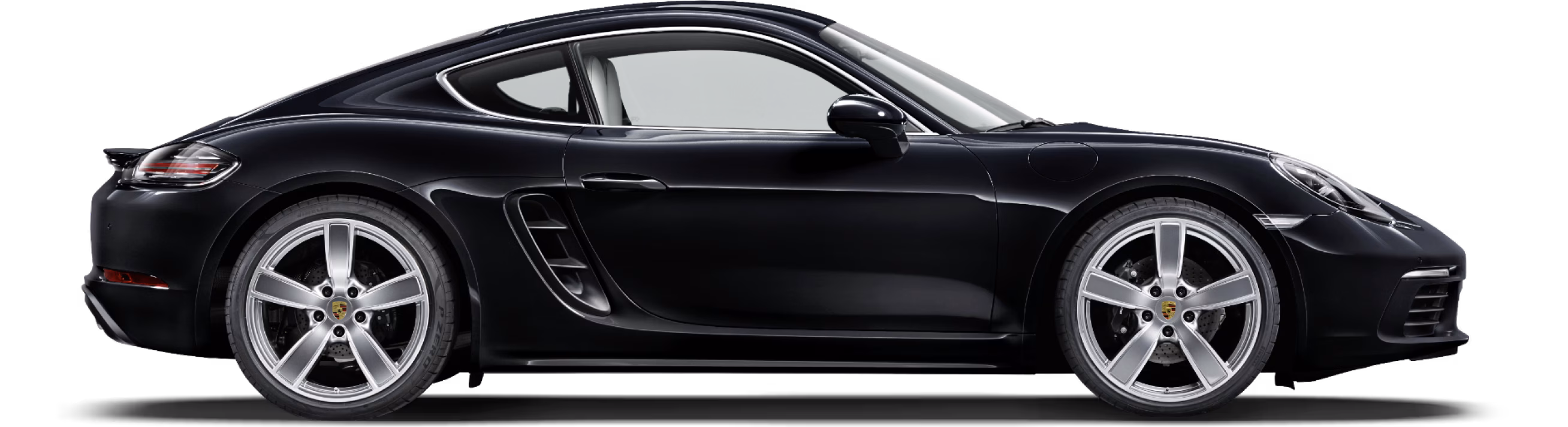 Porsche 718 Cayman in Jet Black Metallic in side view/in profile.