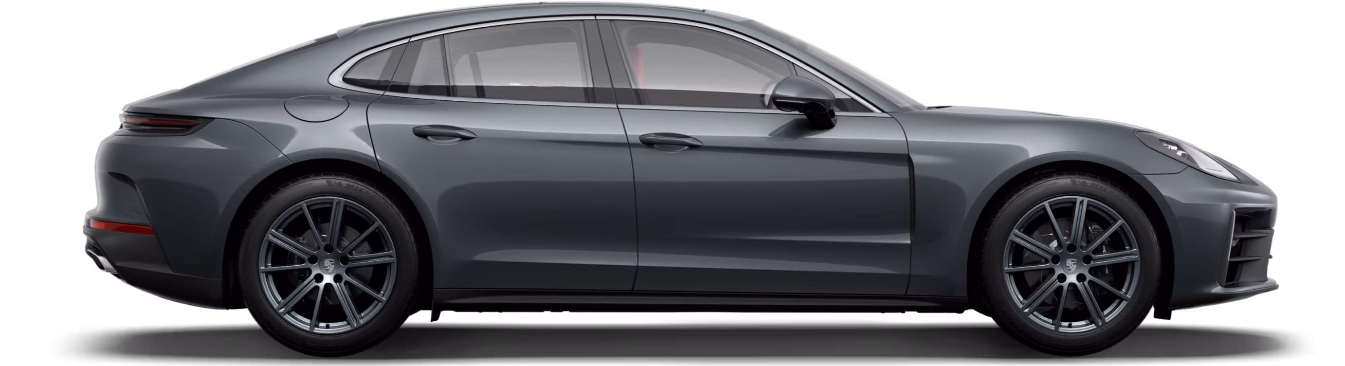 Porsche Panamera in Volcano Grey Metallic in side view / profile.