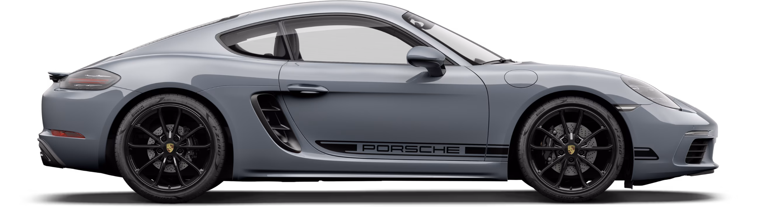 Porsche 718 Cayman Style Edition серого цвета (Arctic Grey) с пакетом контрастной отделки черного цвета, вид сбоку/в профиль.