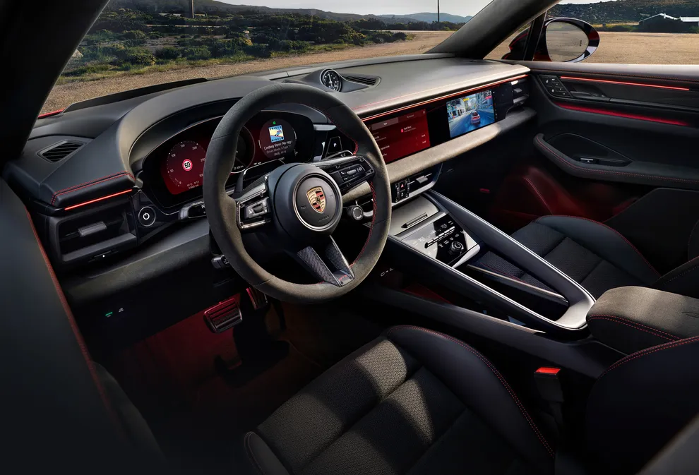 Cockpit view from the driver seat of the Porsche Macan GTS, focusing on the infotainment system.