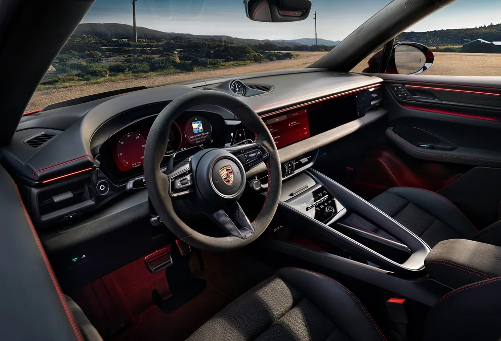 Cockpit view from the driver seat of the Porsche Macan GTS, focusing on the infotainment system.