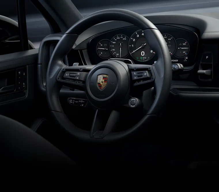 Vista detallada del volante deportivo GT en el Porsche Cayenne Black Edition.