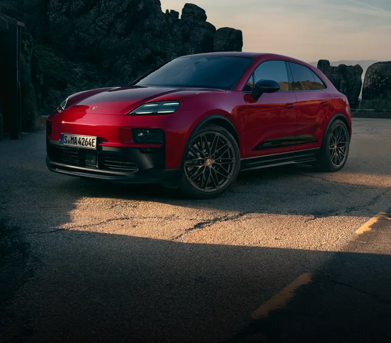 Front and side view of a Porsche Macan GTS in Carmine Red.