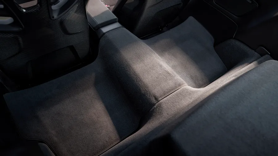 Interior of the Porsche 911 Carrera GTS. View of the cover of the removed rear seat assembly.