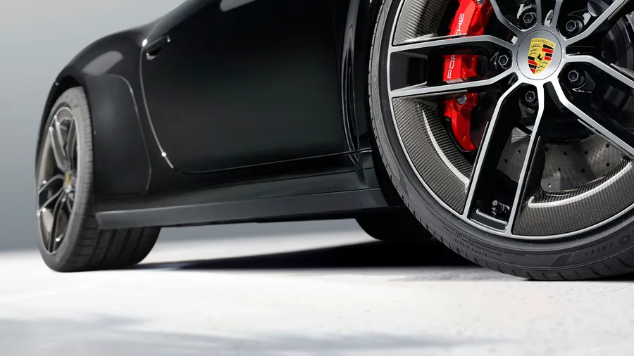 Porsche 911 Carrera GTS Cabriolet in Black. Side view.