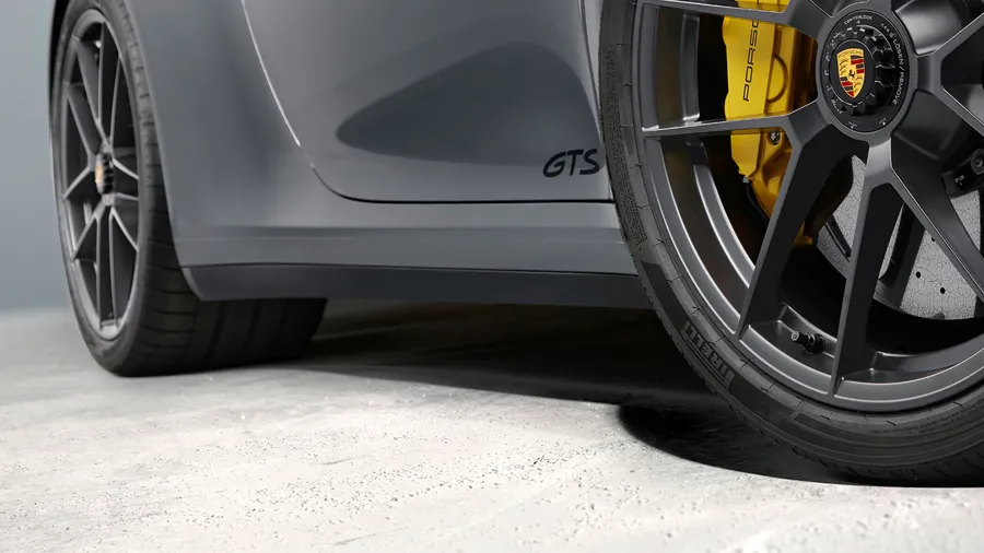 Porsche 911 Carrera GTS in Slate Grey Neo. Side view.