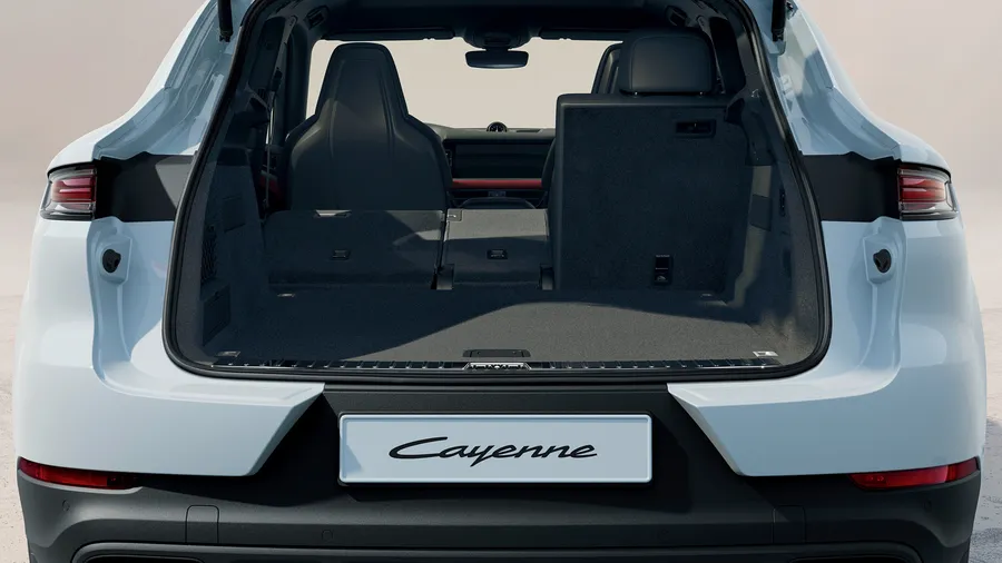 Porsche Cayenne E-Hybrid Coupé in Carrara White Metallic. Rear end view with luggage compartment open.