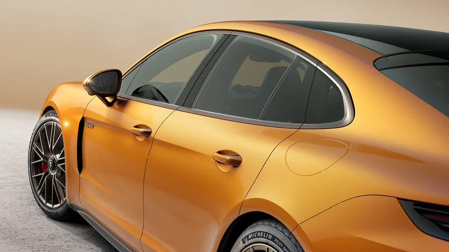 Porsche Panamera Turbo E-Hybrid in Madeira Gold Metallic. Close up of the side window trims in Turbonite.